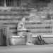 A street musician in Bremen preparing his amplifier under the arches in front of the Rathaus on Marktplatz.