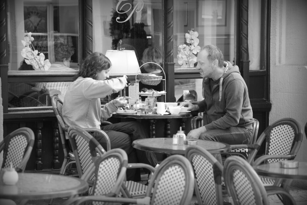 A couple eating breakfast outside the Café Prag in Schwerin.