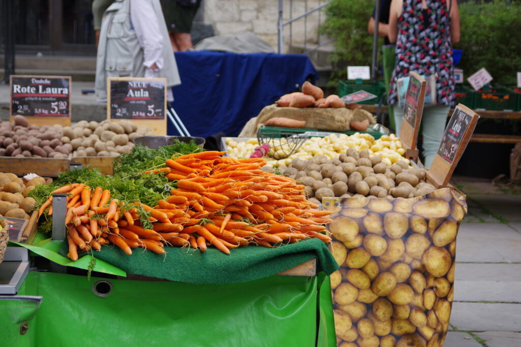 Carrots and potatoes at the weekly market in Braunschweig.