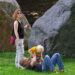 CSD Bremen: A small family, with one parent playing with a small child on the grass prior to the parade.