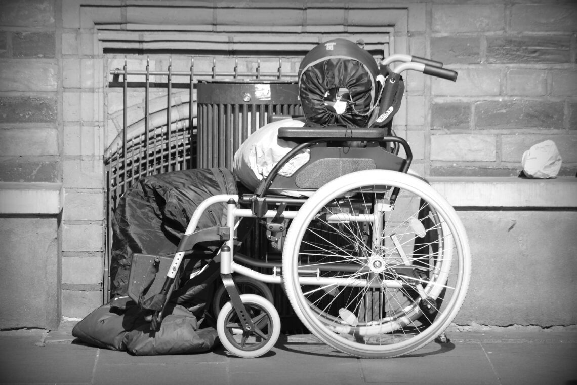 An wheelchair packed with a sleeping bag and wrapped clothing, belonging to a homeless person in Bremen. Copyright: Urban Camera 2025