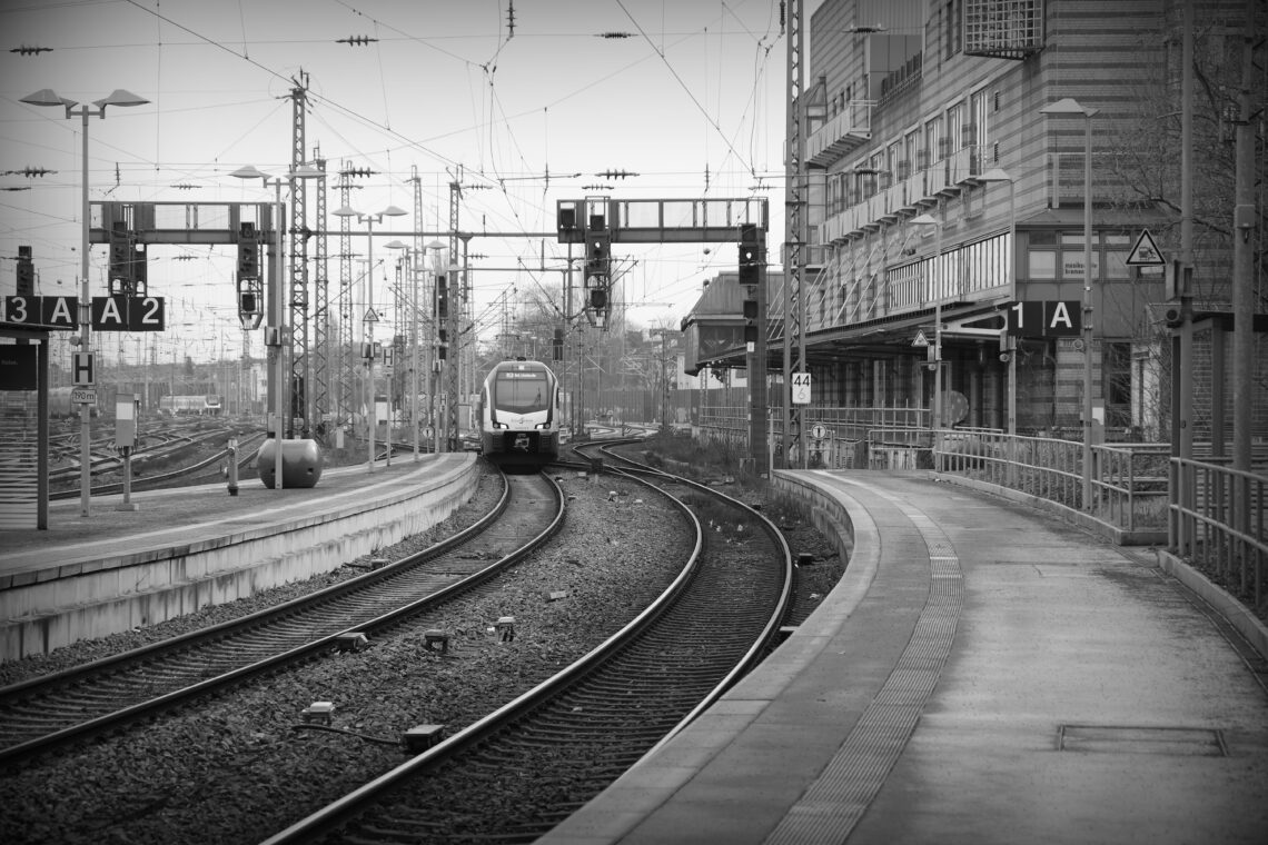 A view of train lines ad platforms with a local express train at Bremen main railway station. Copyright Urban Camera 2025.