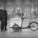 Black and white photograph of a group serving coffee to homeless people at Bremen railway station. Copyright Urban Camera.